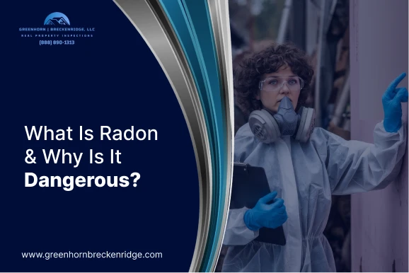 A professional inspector in a hazmat suit and respirator mask pointing to a wall during a radon inspection.